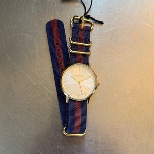 Nixon Gold Watch with Blue and Red Strap
